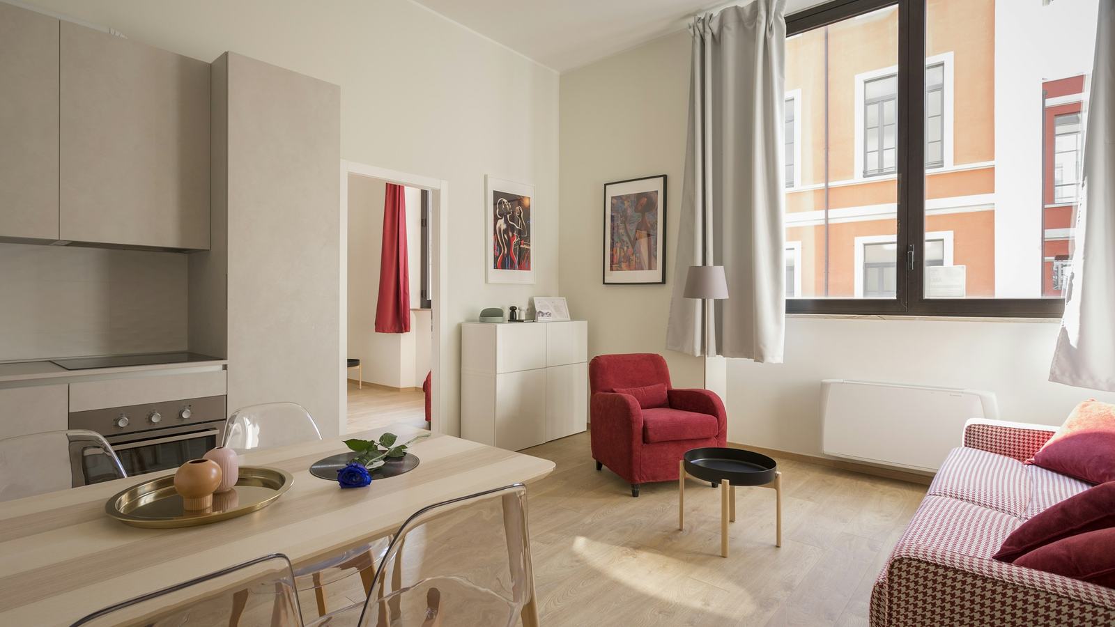 Bright studio suite with a kitchenette and living area