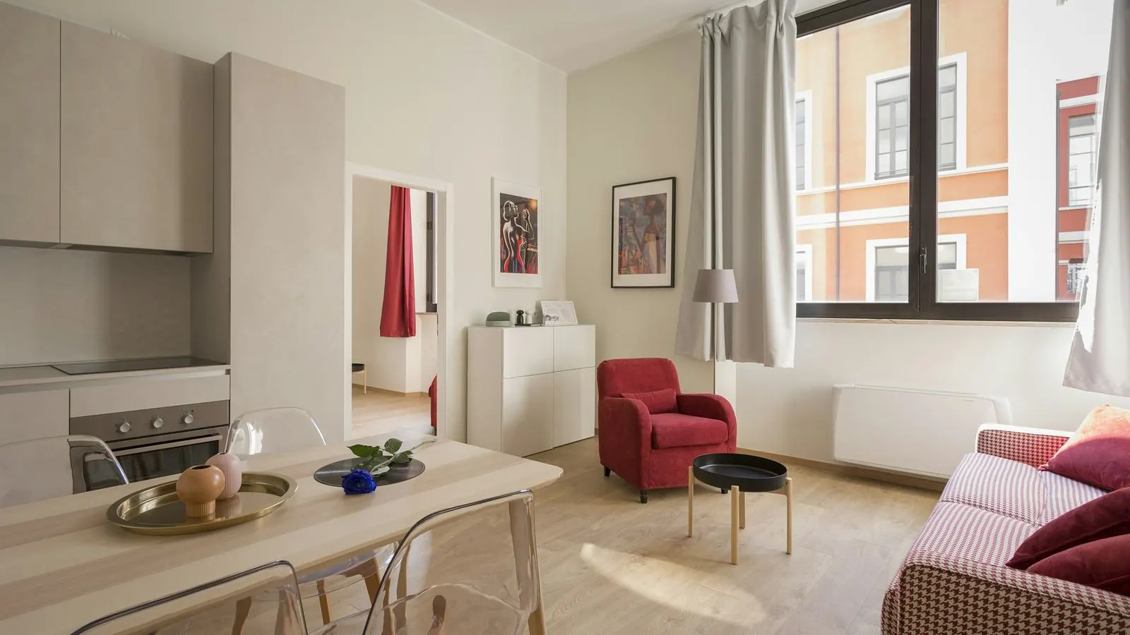 Bright studio suite with a kitchenette and living area
