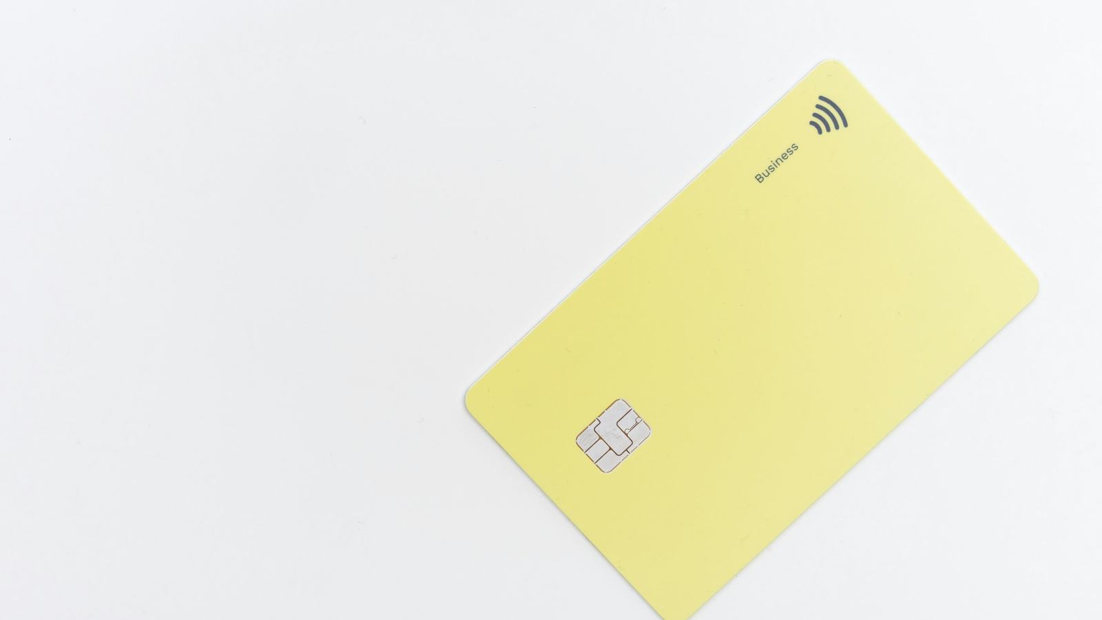 Unbranded contactless business credit card on a white surface