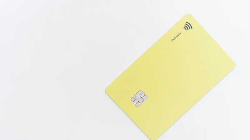 Unbranded contactless business credit card on a white surface
