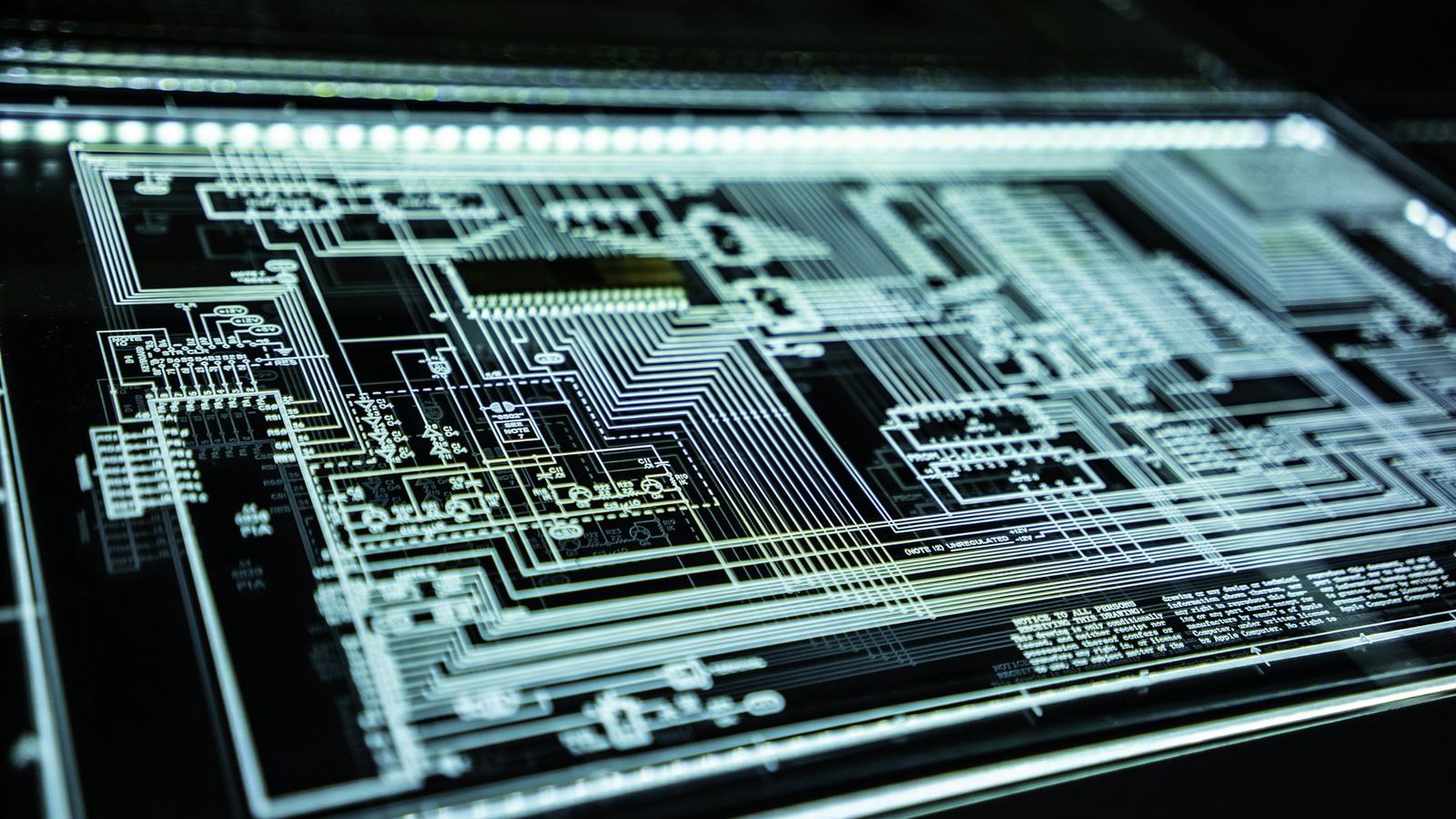 Illuminated circuit board pattern representing cybersecurity