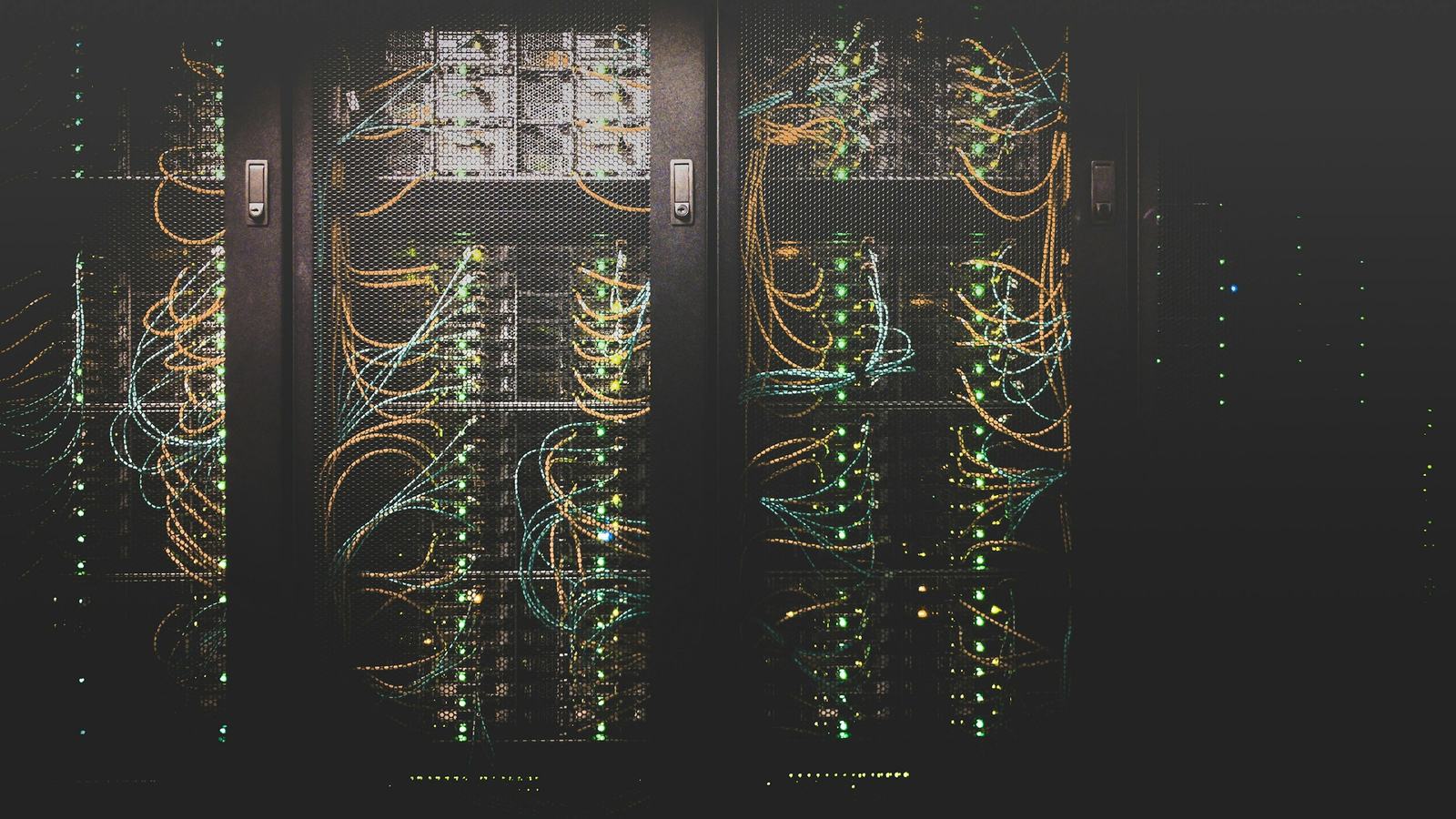 Server racks with network cabling in a data room