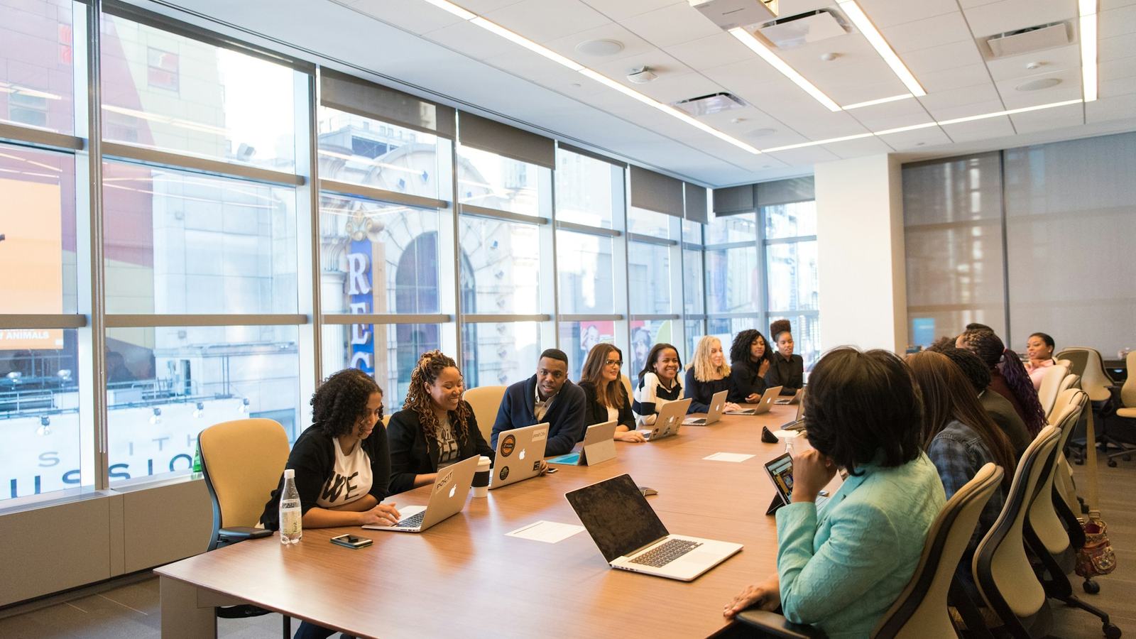 Team meeting around a long boardroom table