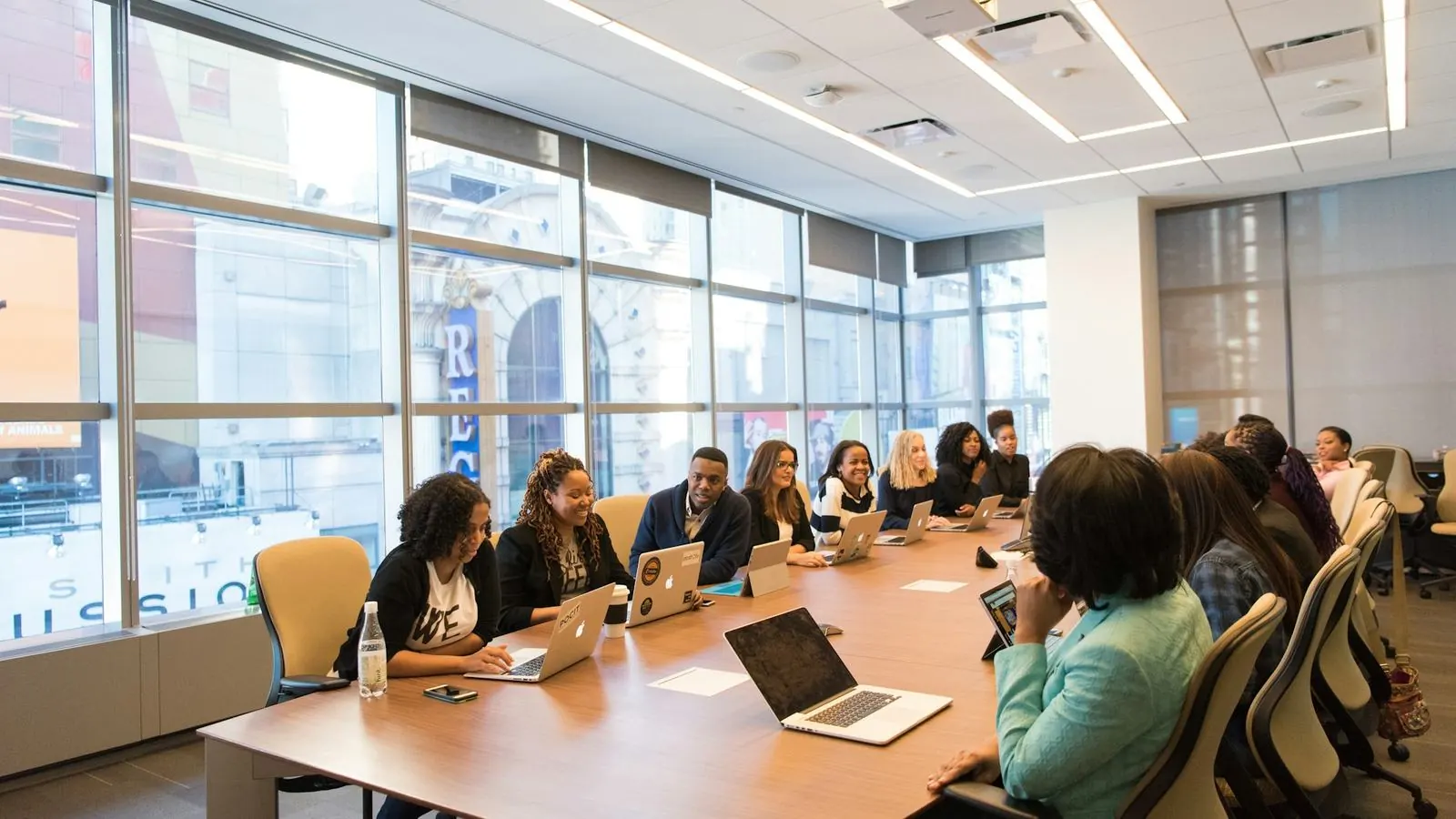 Team meeting around a long boardroom table