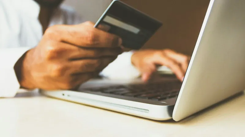 Paying with a card on a laptop